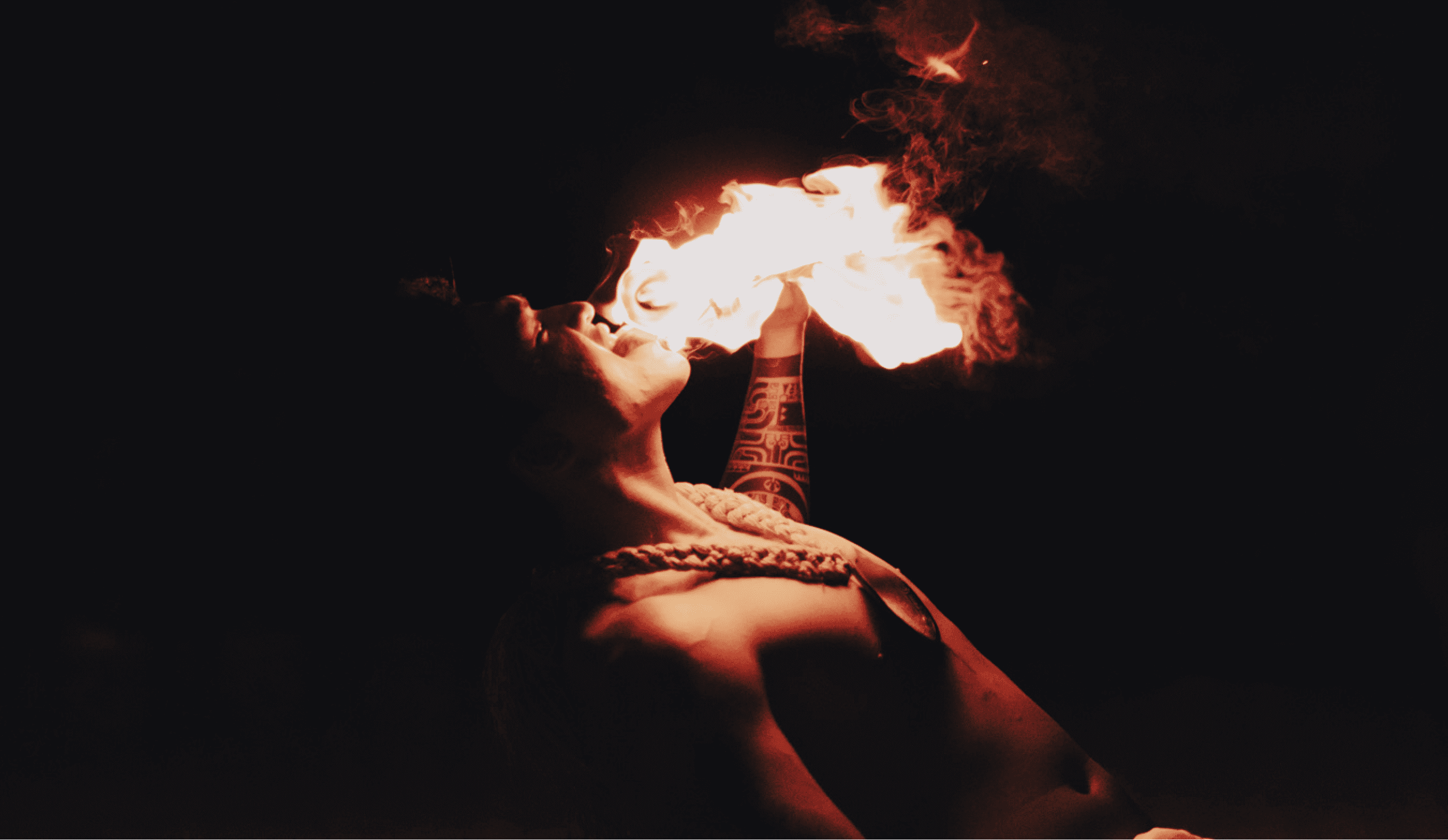 Close up of a dancer breathing fire at our Tahiti all inclusive resort