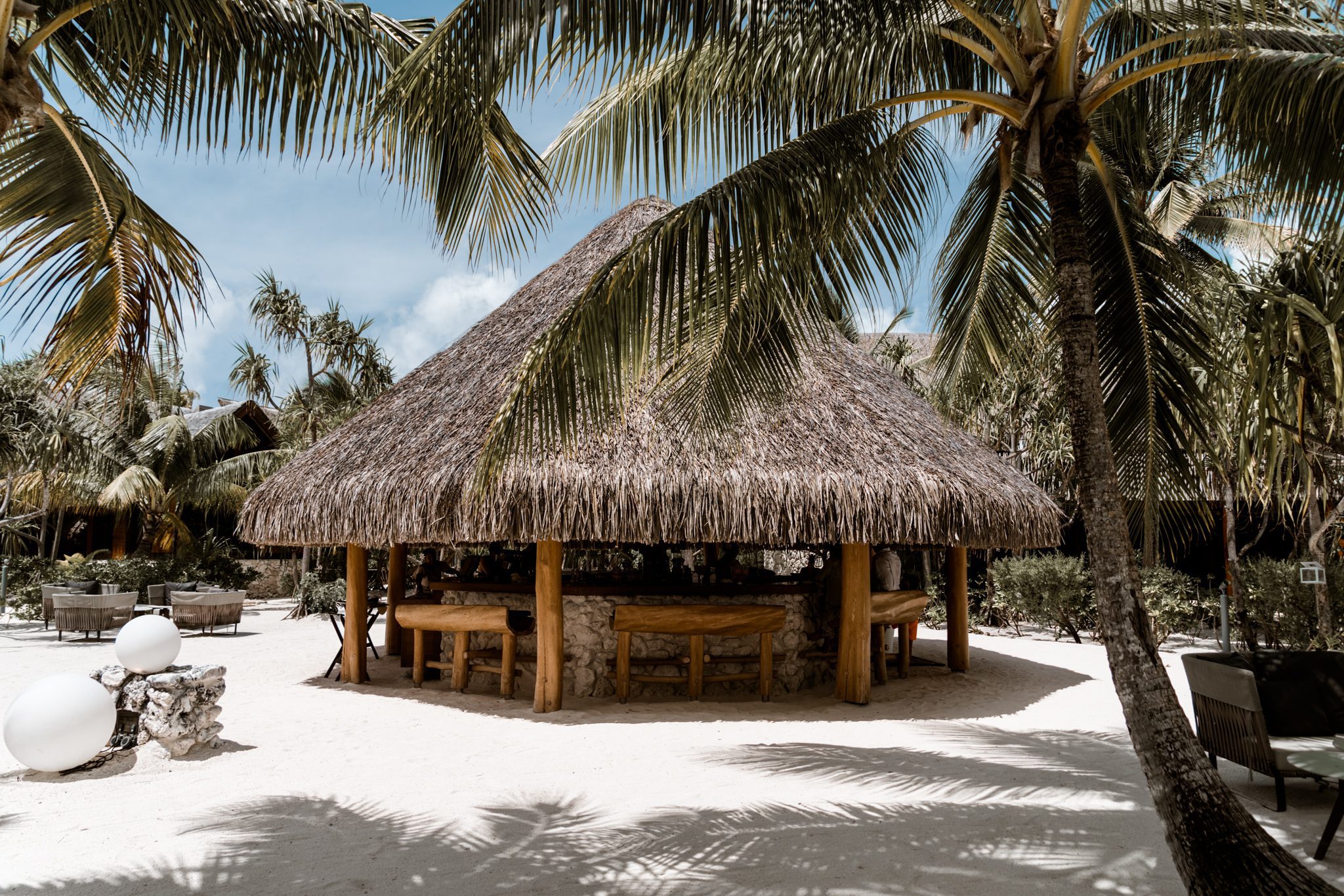 Outdoor bar with a thatched roof at our all inclusive Tahiti resort