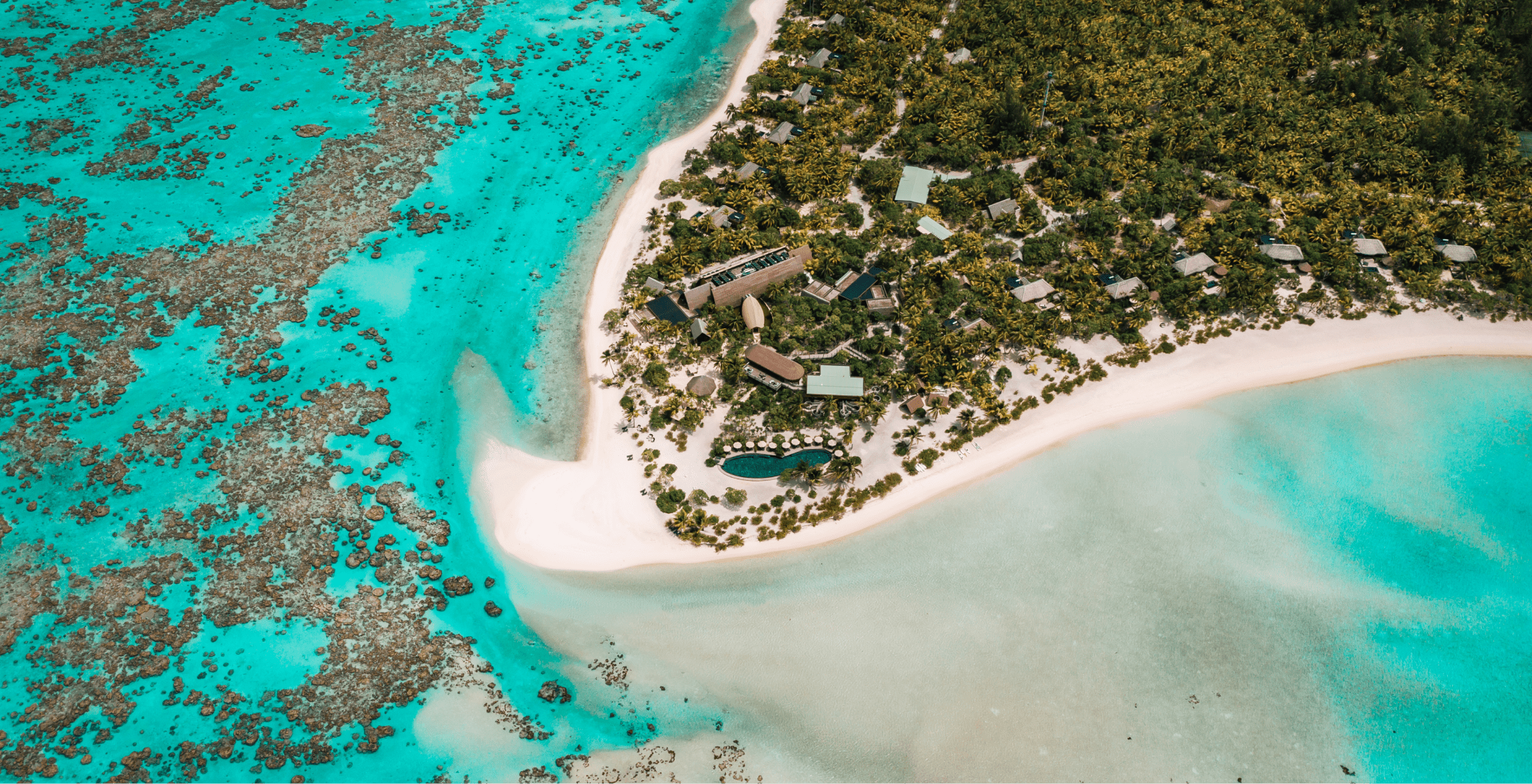 Bird's-eye view of The Brando resort in Tahiti, jutting into the ocean
